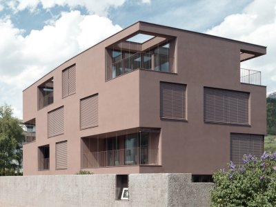 Ein modernes Haus mit Raffstoren in gleicher Farbe wie die Fassade.